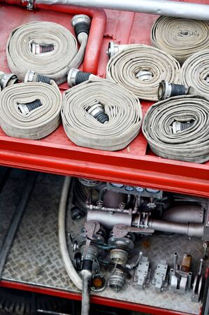 Detail with heavy duty water hoses on top of a firefighter vehicleの写真素材