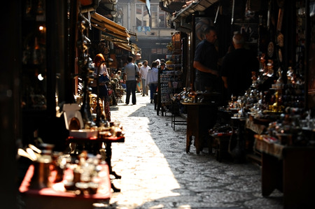 BOSNIA, SARAJEVO - AUGUST 27: Tourists looking at souvenirs in old Sarajevo bazaar on August 27, 2015 in Sarajevo.のeditorial素材