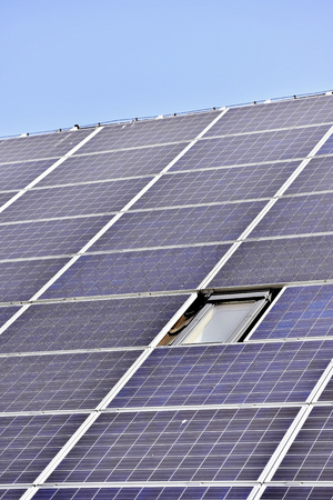 House roof with renewable energy solar and thermal photovoltaic panels