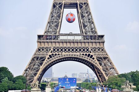 PARIS, FRANCE - JUNE 8: Giant soccer ball suspended on the Eiffel Tower during the UEFA 2016 European Championship on June 8, 2016 in Paris.のeditorial素材