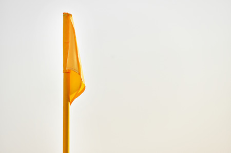 Detail shot with yellow corner flag on a soccer fieldの写真素材