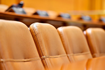 Office executive board leather chairs in front of wooden table