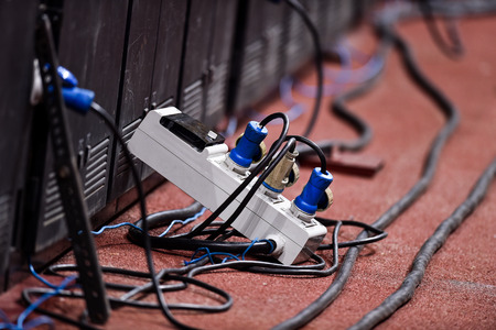 Industrial power plugs and sockets connected on a panelの写真素材