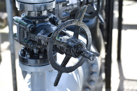 Industrial detail shot with oil pipelines and valvesの写真素材