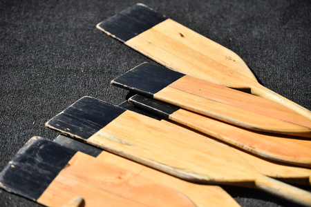 Detail shot with several wooden canoe paddlesの写真素材