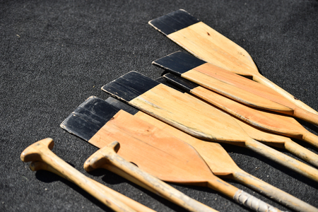 Detail shot with several wooden canoe paddlesの写真素材