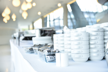 Empty catering plates, platters and trays setup before eventの写真素材