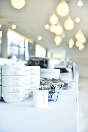 Empty catering plates, platters and trays setup before eventの写真素材