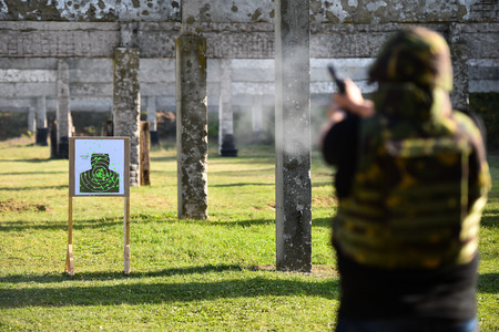 Outdoor shooting with a 9mm pistol in a shooting range