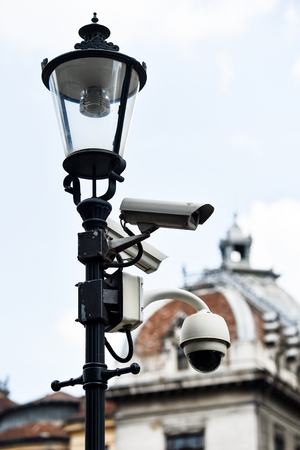 Video surveillance camera on a lighting poleの写真素材