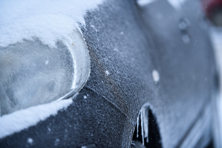 Car covered in ice during freezing rain phenomenonの写真素材