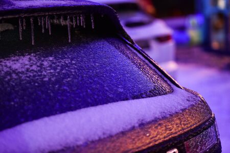 Car covered in ice during freezing rain phenomenonの写真素材