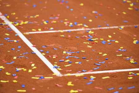 Detail show with confetti on a tennis clay courtの写真素材