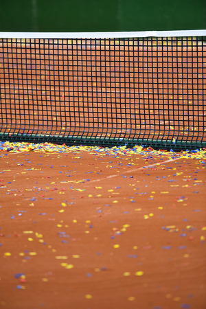 Detail show with confetti on a tennis clay courtの写真素材