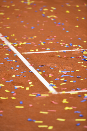 Detail show with confetti on a tennis clay courtの写真素材