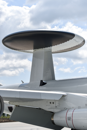 Huge radar antenna on a military airplaneの写真素材