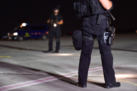 Night scene with special forces showing their skills in a simulated hostage rescue drill