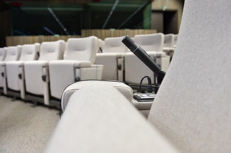 Detail shot with a press microphone in a conference roomの写真素材