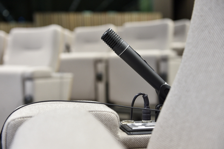 Detail shot with a press microphone in a conference roomの写真素材