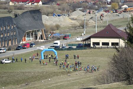ZARNESTI, ROMANIA - MARCH 30, 2019: Athletes compete during a spring ski touring and trail running competition in Piatra Craiului mountains.のeditorial素材