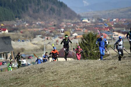ZARNESTI, ROMANIA - MARCH 30, 2019: Athletes compete during a spring ski touring and trail running competition in Piatra Craiului mountains.のeditorial素材