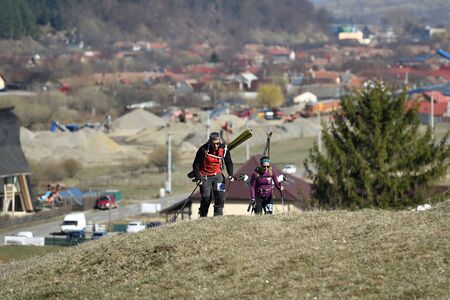 ZARNESTI, ROMANIA - MARCH 30, 2019: Athletes compete during a spring ski touring and trail running competition in Piatra Craiului mountains.のeditorial素材