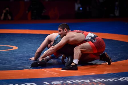 BUCHAREST, ROMANIA - APRIL 10, 2019: Taha Akgul from Turkey, competes against Geno Petriashvili, from Georgia, during the European Wrestling Championship in Bucharest.のeditorial素材