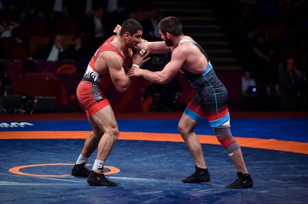 BUCHAREST, ROMANIA - APRIL 10, 2019: Taha Akgul from Turkey, competes against Geno Petriashvili, from Georgia, during the European Wrestling Championship in Bucharest.のeditorial素材