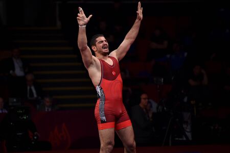 BUCHAREST, ROMANIA - APRIL 10, 2019: Taha Akgul from Turkey, competes against Geno Petriashvili, from Georgia, during the European Wrestling Championship in Bucharest.のeditorial素材