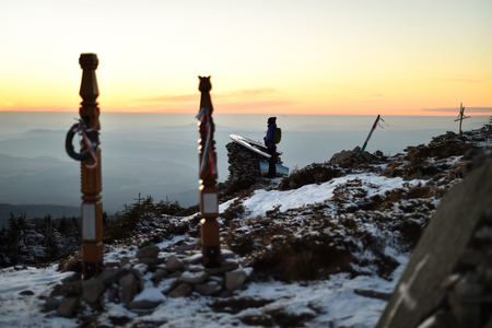 Wooden crosses on the top of a mountain in winter seasonの写真素材