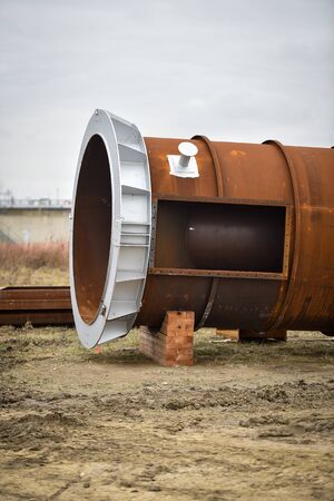 Detail with a huge industrial pipe on a construction site.の写真素材