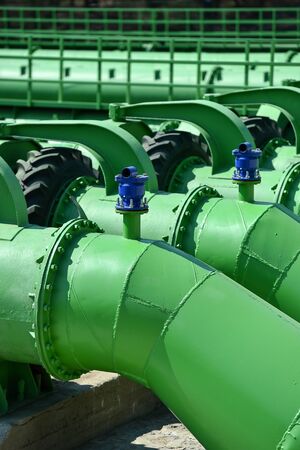 Industrial pipes used to pump water from a river to irrigate drought fieldsの写真素材