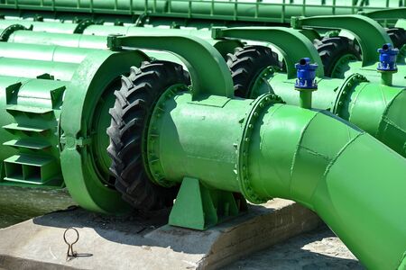 Industrial pipes used to pump water from a river to irrigate drought fieldsの写真素材