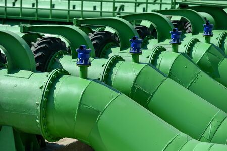 Industrial pipes used to pump water from a river to irrigate drought fieldsの写真素材