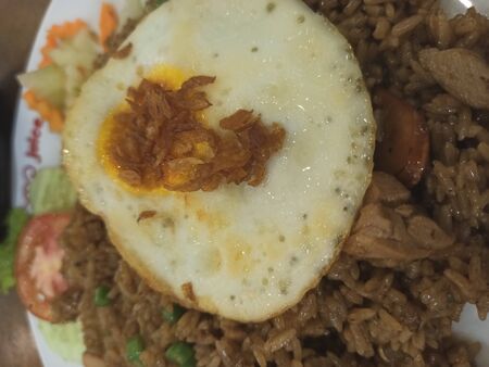 Egg with rice, vegetables and meat.の写真素材