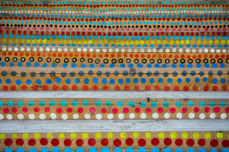 Colorful circles painted on the wooden stairsの写真素材