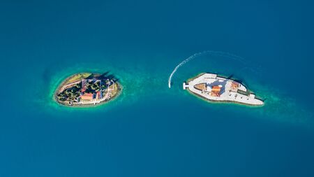 Aerial photo of St. George and monastery on the islands near Perast town in Kotor bayの写真素材
