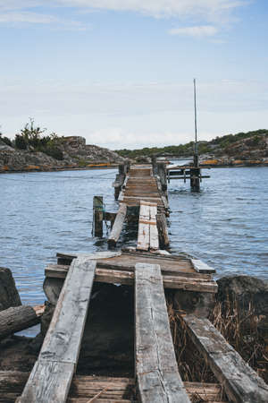 Wooden jetty on a small islandの写真素材