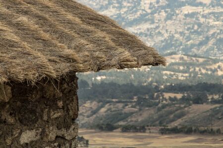 Straw roof of a house in the mountains