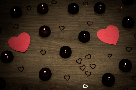 Candles with red hearts and rosesの写真素材