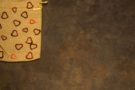 Fabric sack with hearts on rustic background for Valentine's day.の写真素材