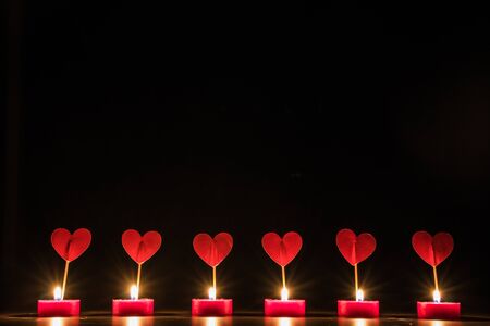 Candles and hearts  valentine's concept. Black backgroundの写真素材