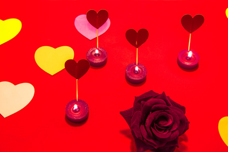 Red background with coloured hearts and a rose. Letter to Saint Valentine の写真素材