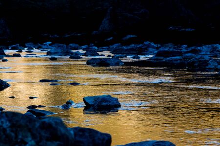 Lake in the mountain with beautiful reflections. With a water damの写真素材