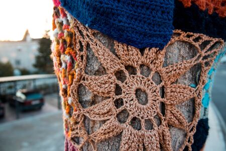 Trees with storm yarn. Colored wool texture. Street Art. Hippie concept