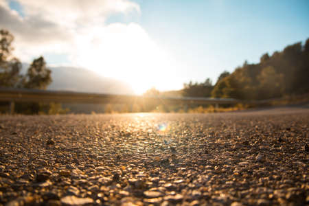 Sunset from a road, asphalt texture. Concept of freedomの写真素材