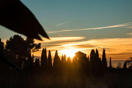 Sunset with a castle and nature in the background. And the cloudy skyの写真素材