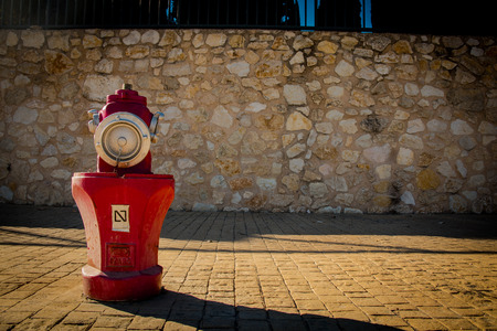 Fire hydrant on the street.Red colour