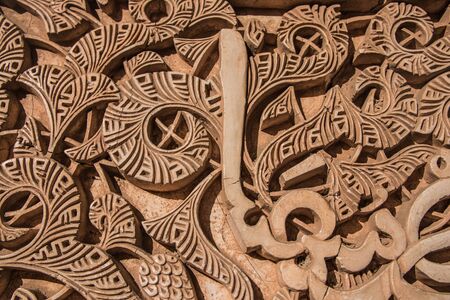 Texture of Arabic engravings on the wall of a templeの写真素材