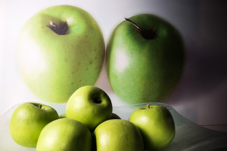 Background with green apples in a bowの写真素材